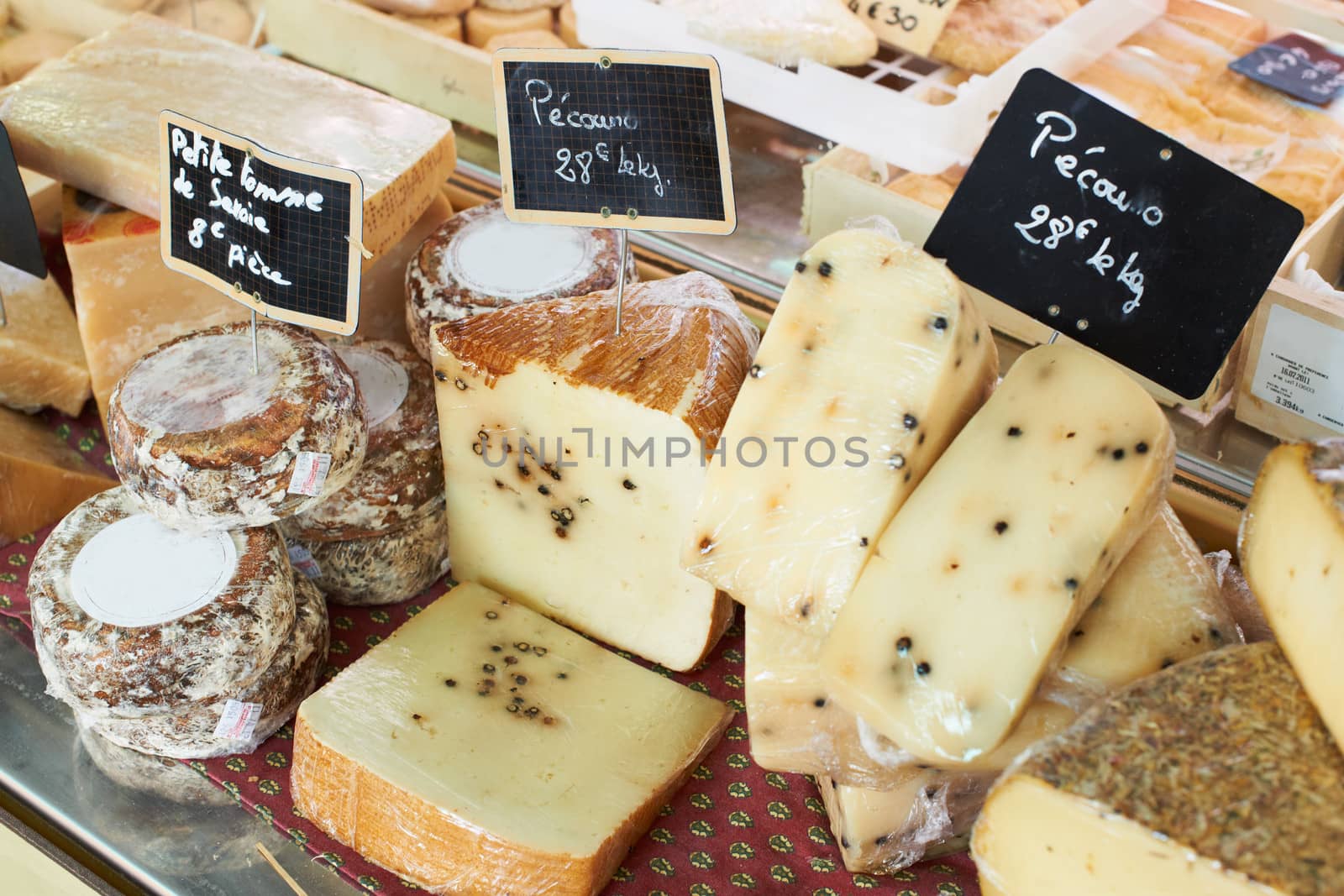 Random sorts of traditional French cheese for sale on Provence market, France