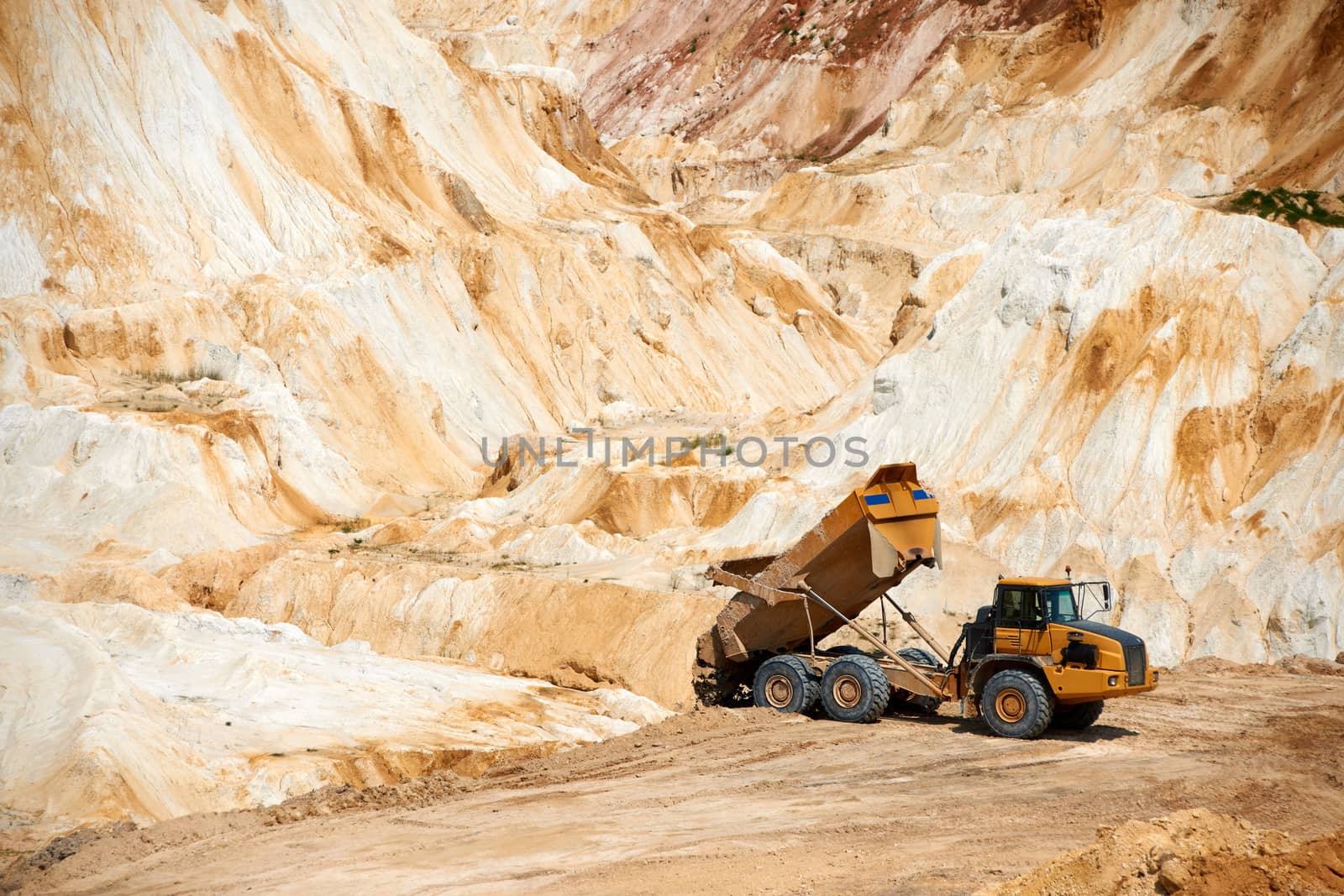 Big truck working in white limestone quarry