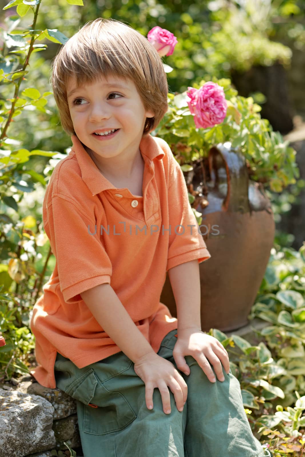 Little boy in rose garden by ecobo