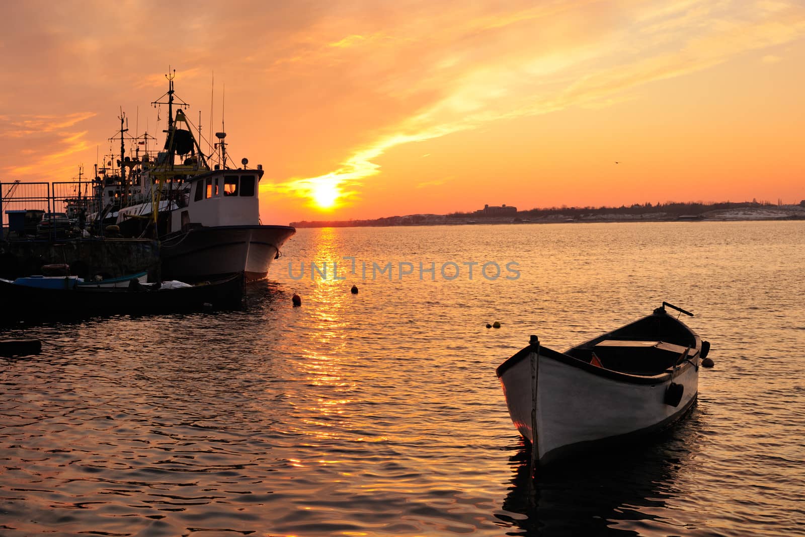 Sunset with boats over Nessebar bay, Black Sea, Bulgaria