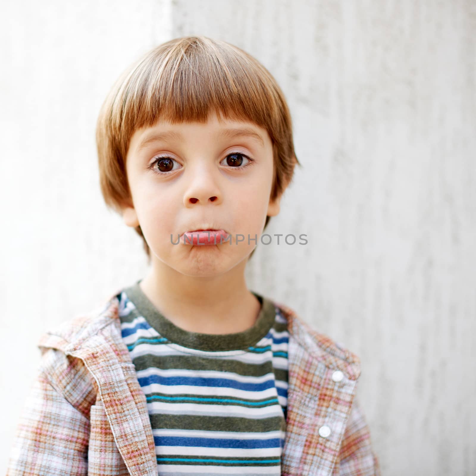 Little cute boy making funny face