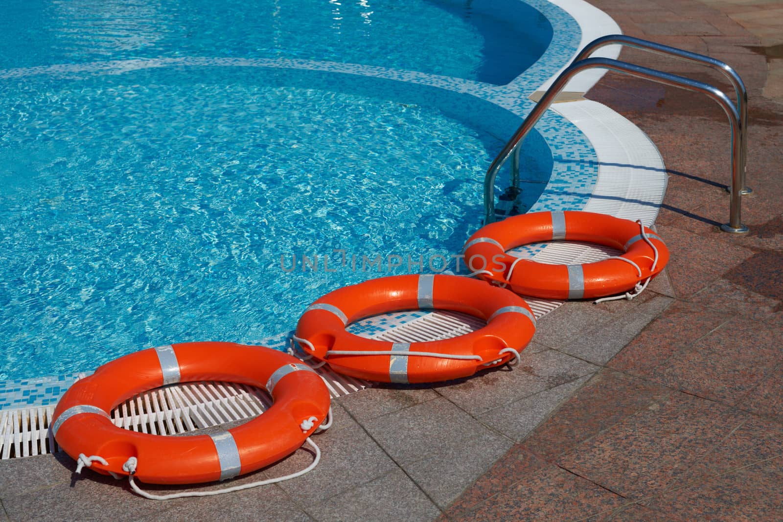 Life-belts near the water of a pool