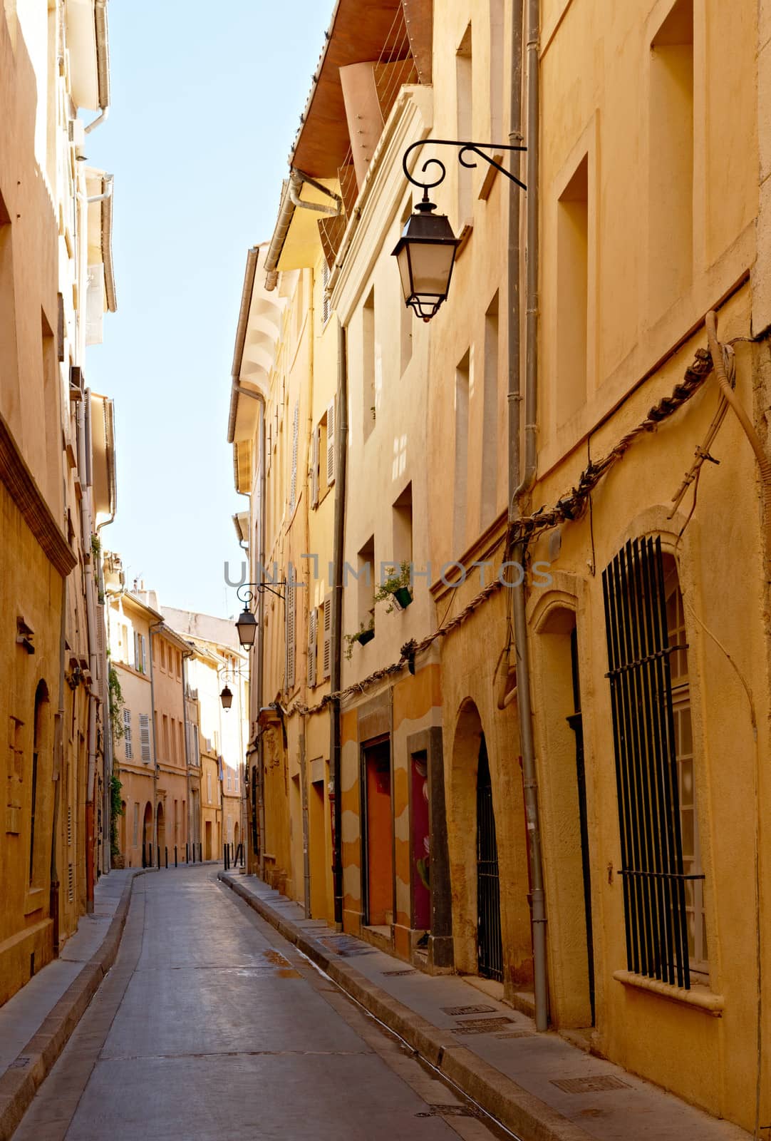 Narrow street with typical houses in Aix en Provence, France