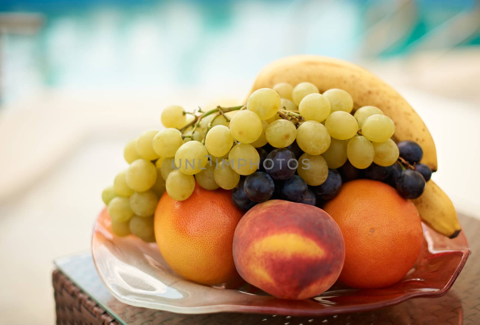 Fresh summer fruits and blue sea water