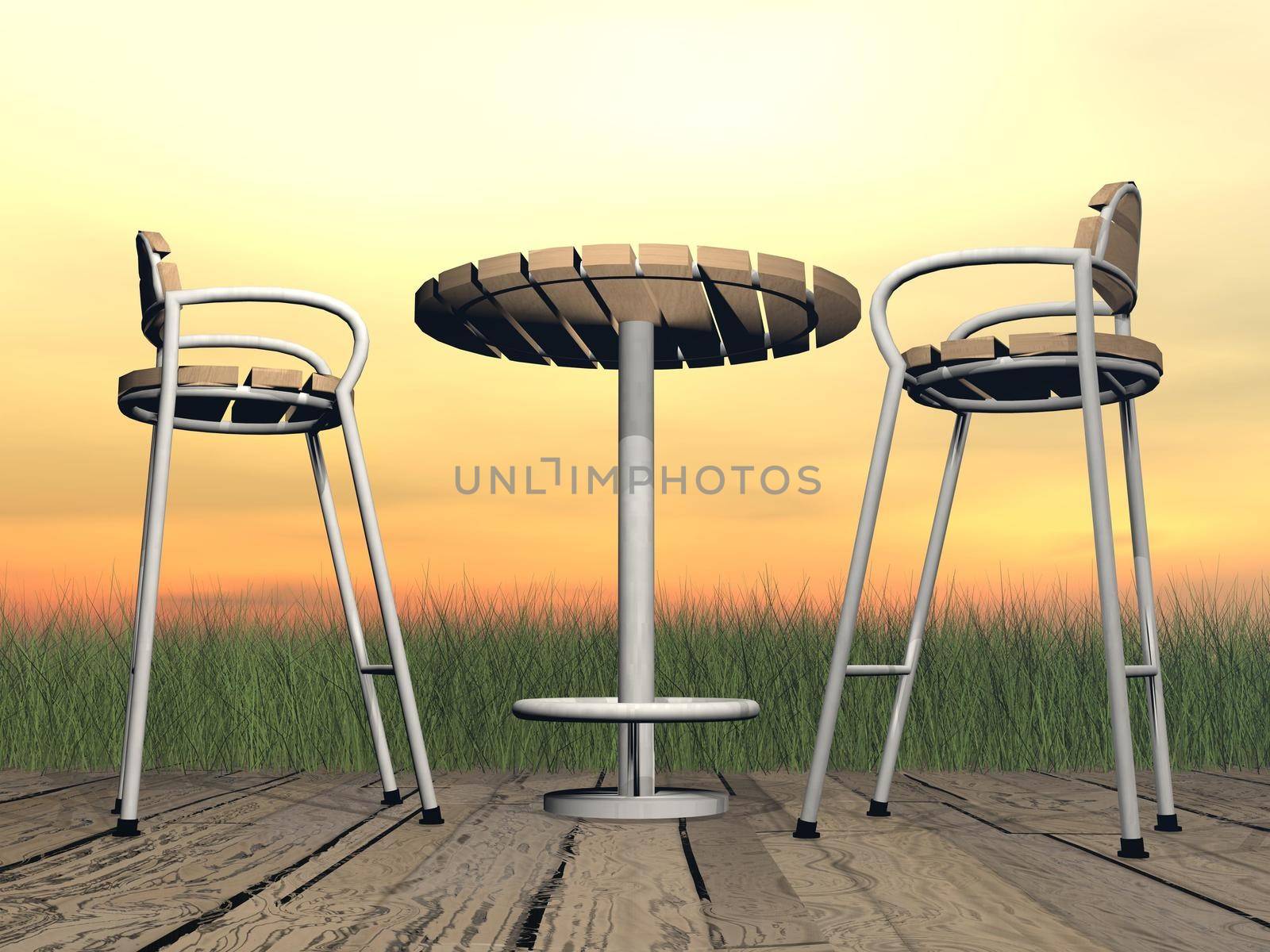 Two chairs and one table on a wooden floor in front of the garden by sunset light