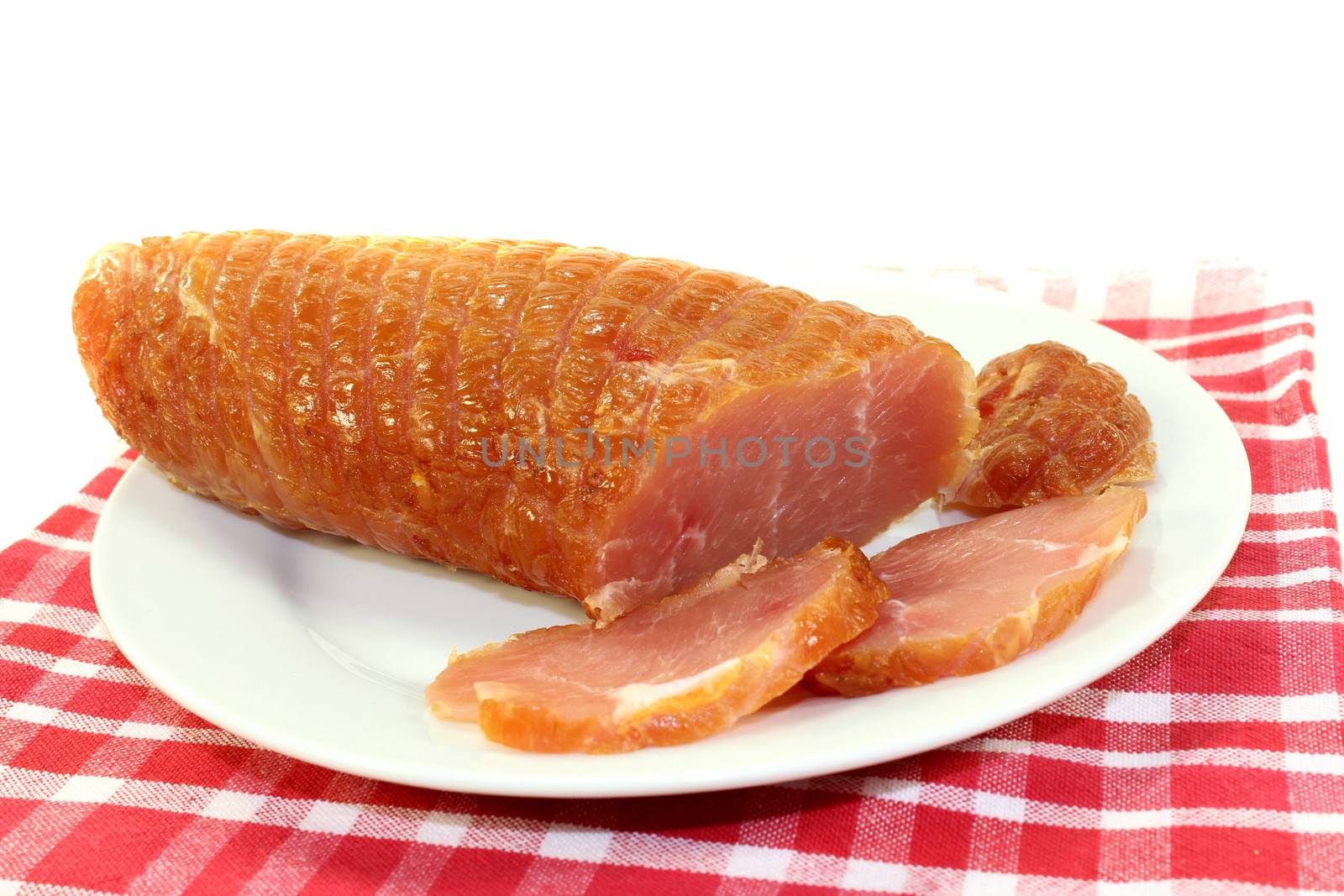a piece of turkey fillet of salmon in front of white background