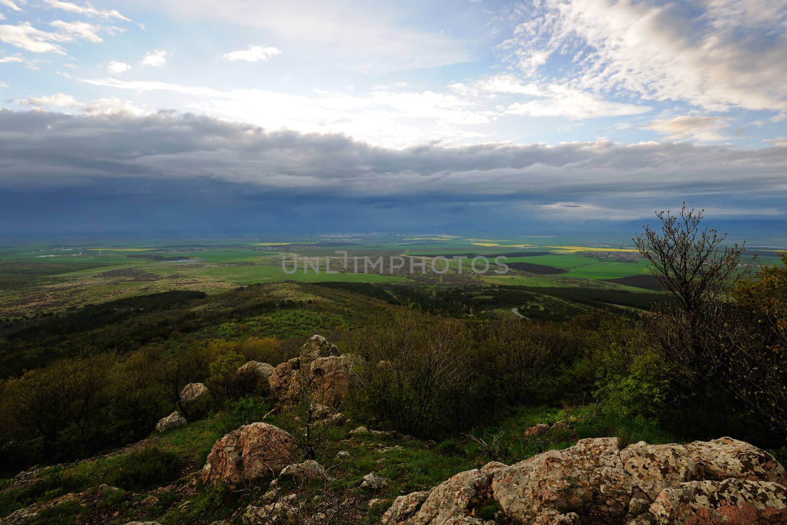 Landscape of countryside with dark storm clouds comming