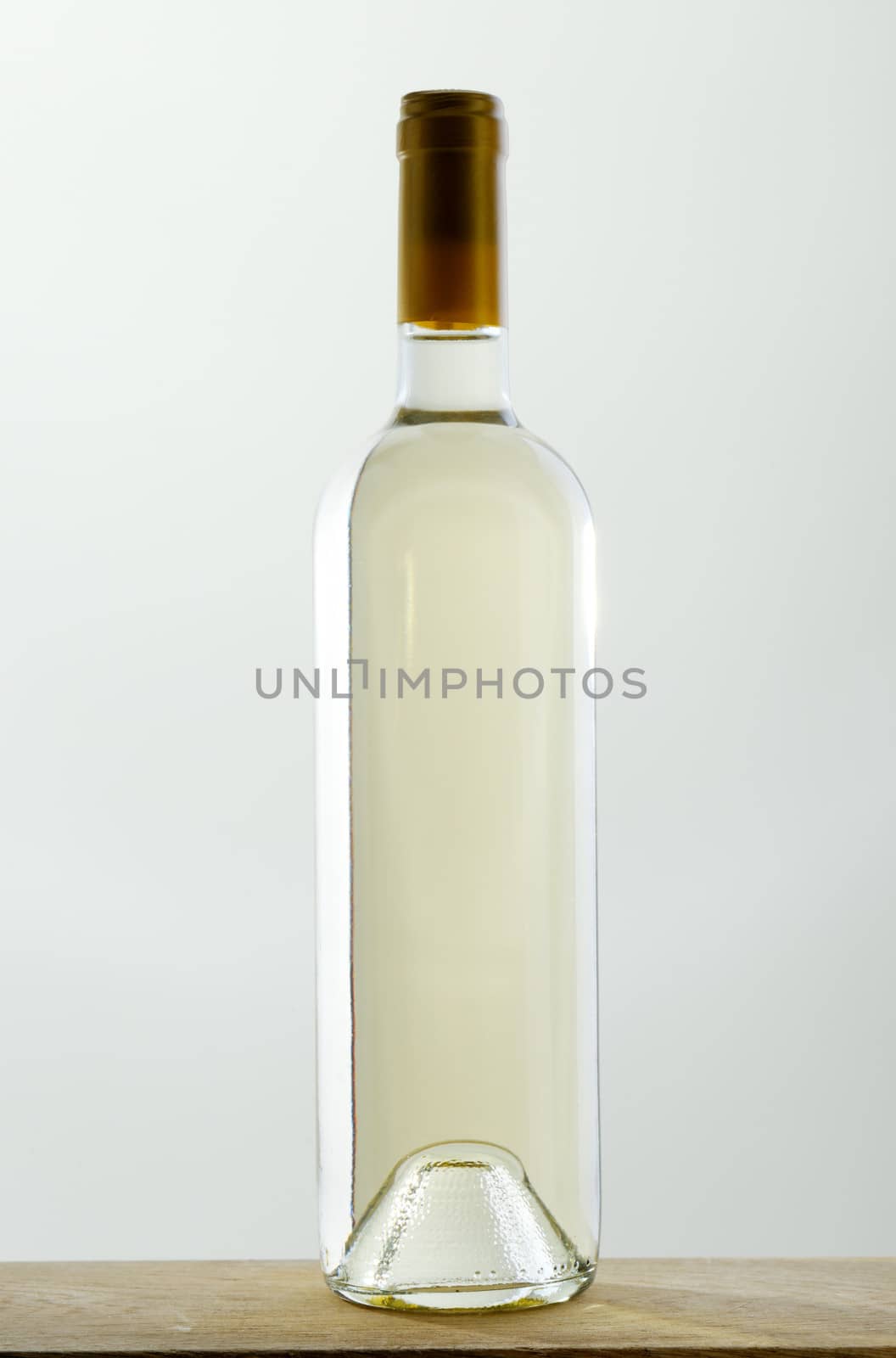 Sealed bottle of white wine without label