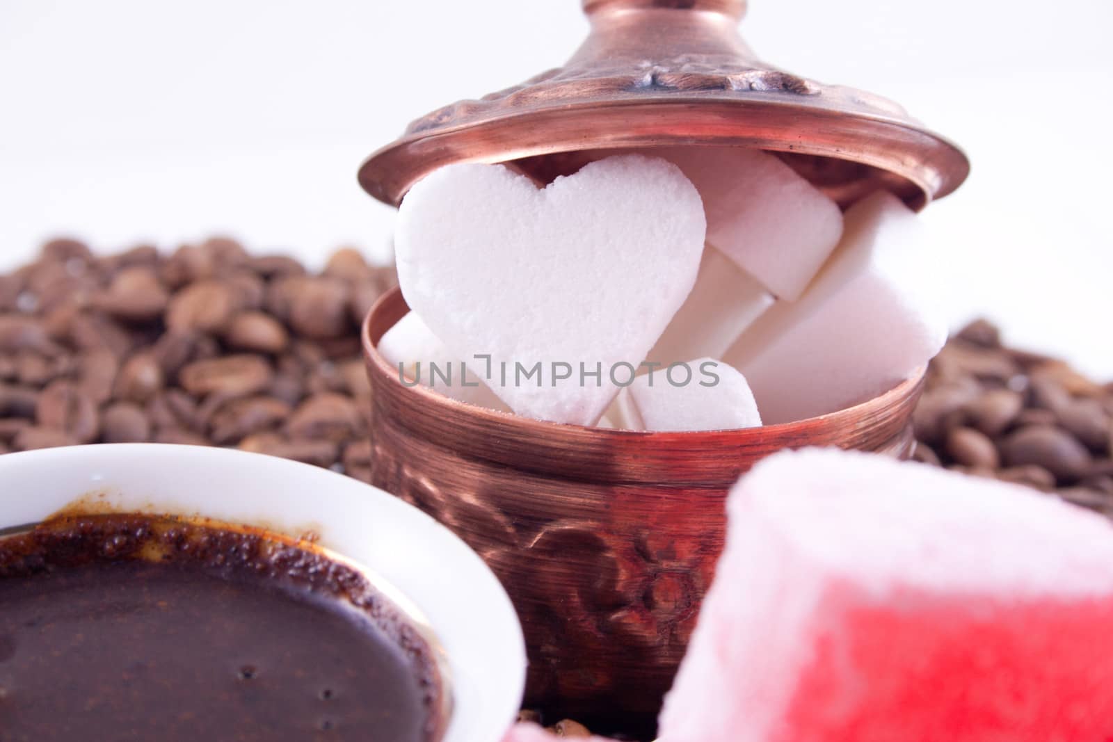 Heart shaped sugar with coffee and sweet