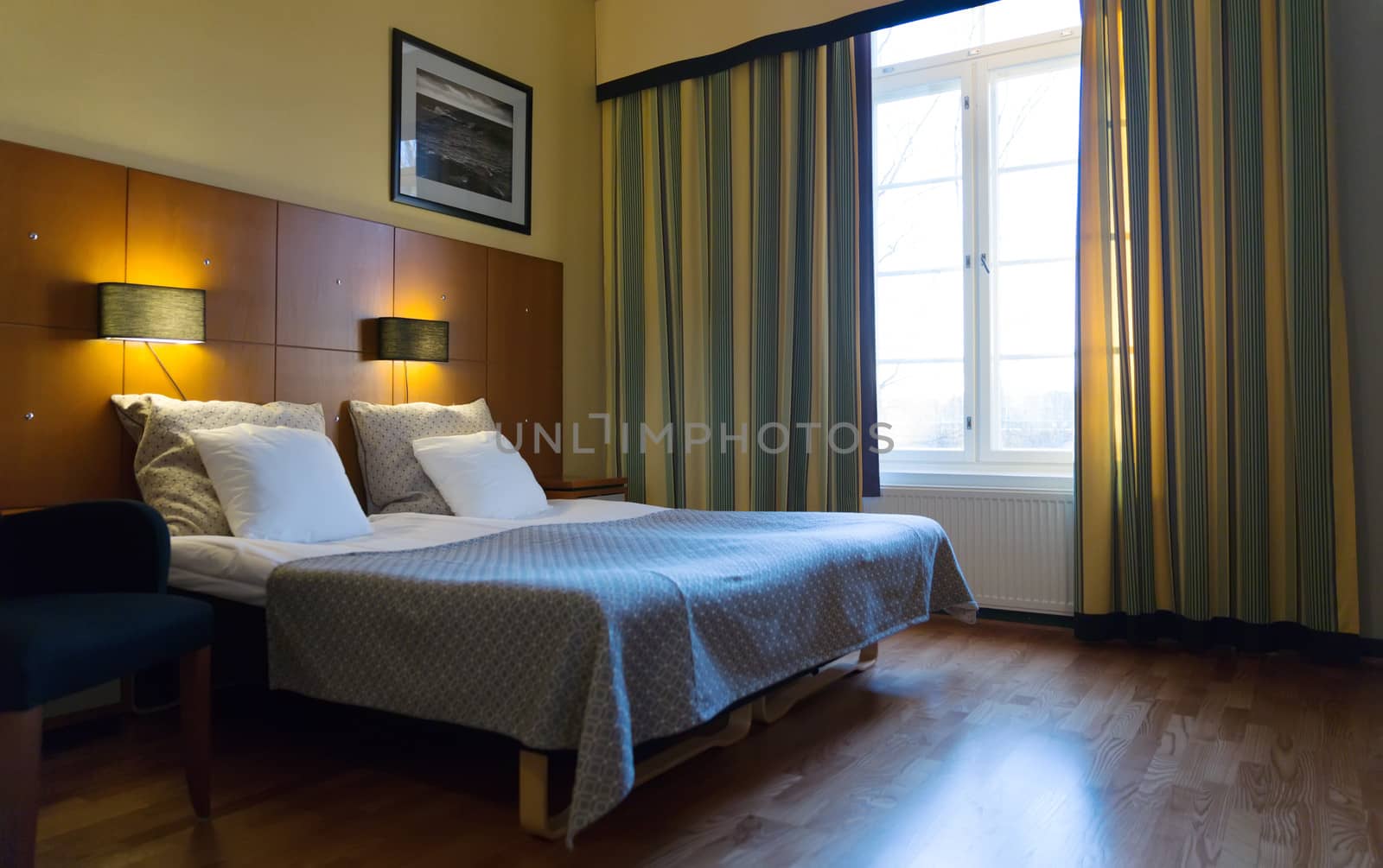 Bedroom with large window in a classic style