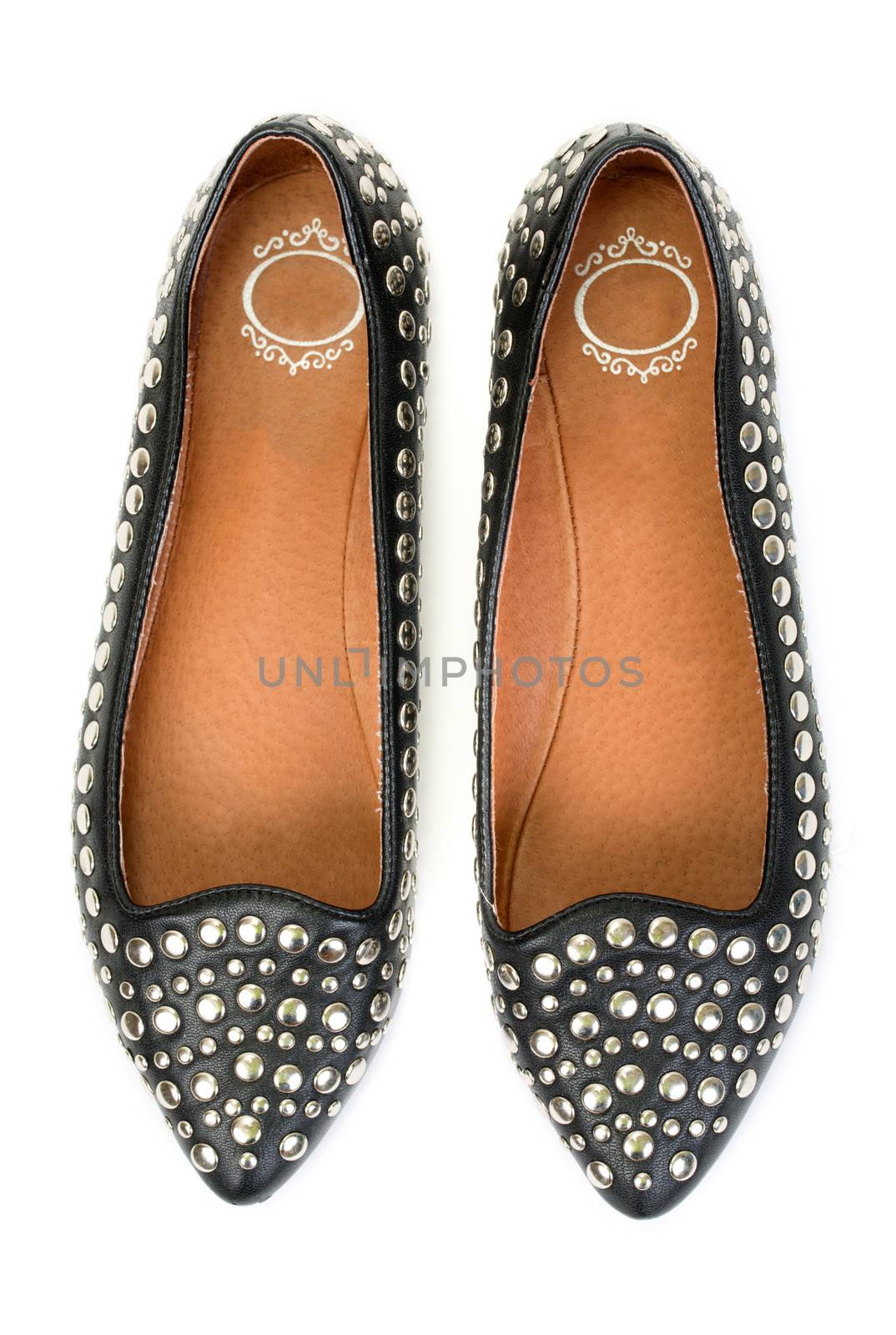 pair of new black leather women's ballet shoes with steel studs. View from above. Isolate on white background