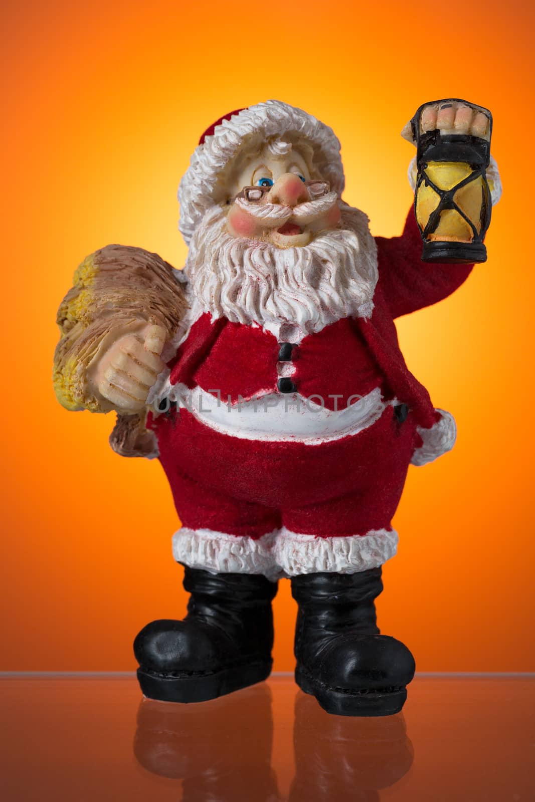 Santa Claus figure on a background of orange spots