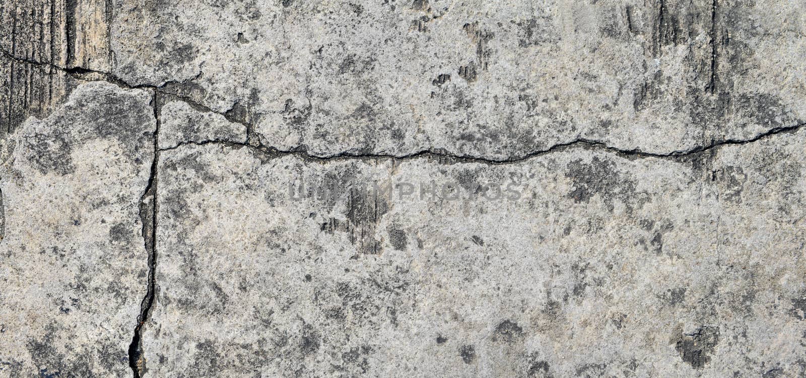 Cracked concrete texture closeup background.  by opasstudio