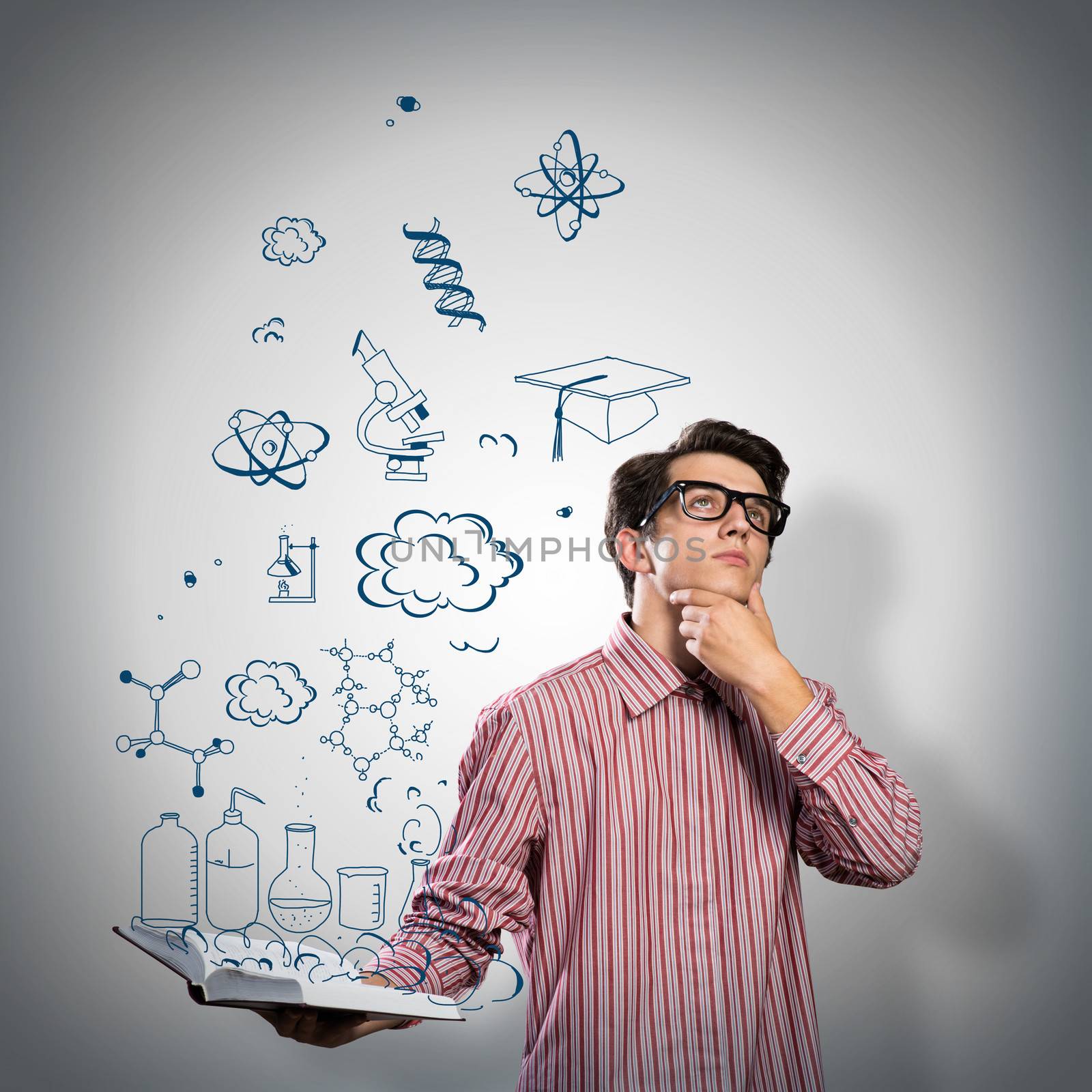 young scientist holding a book by adam121