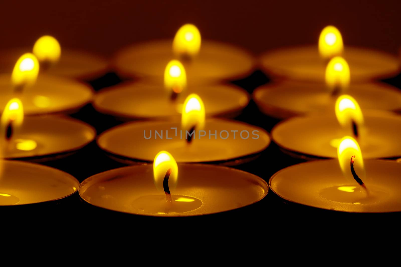 Tea lights candles with fire by Discovod