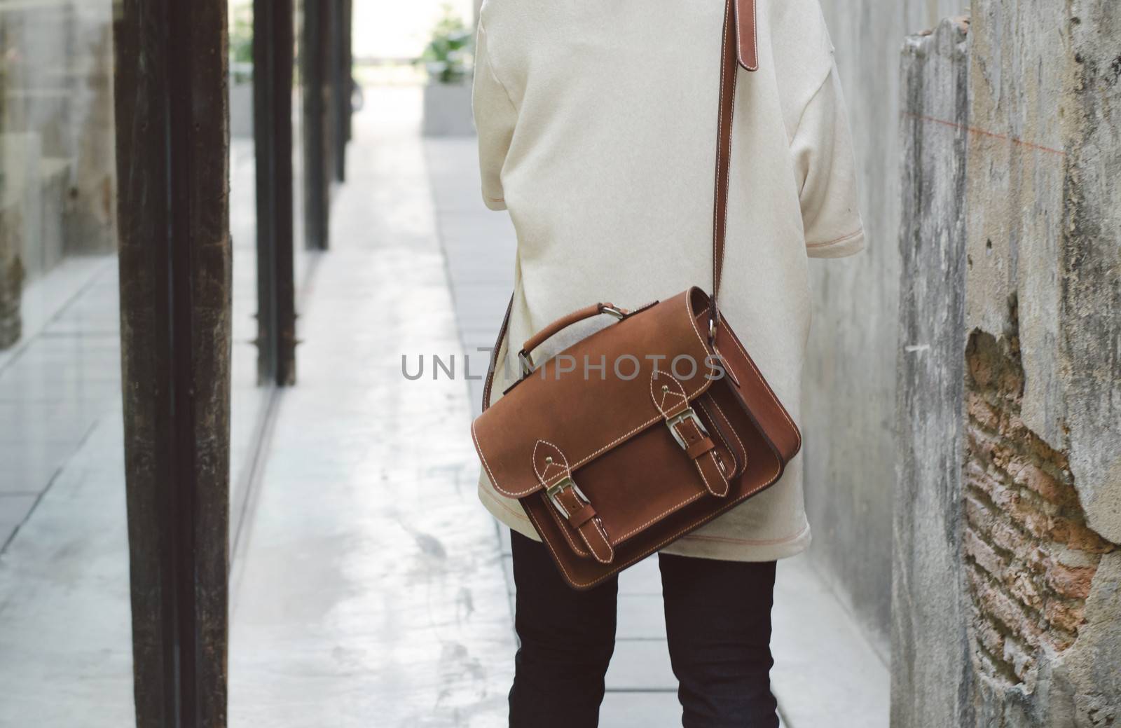 brown leather bag by siraanamwong
