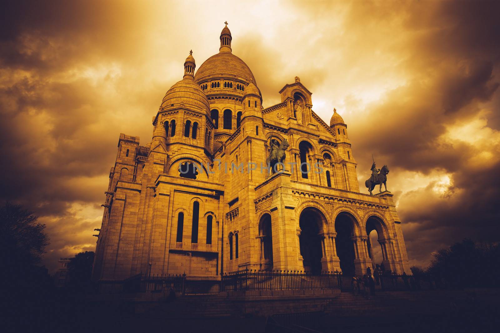 Sacre Coeur in Paris, France, as storm clouds gather. Heavily filtered image for mood and atmosphere.