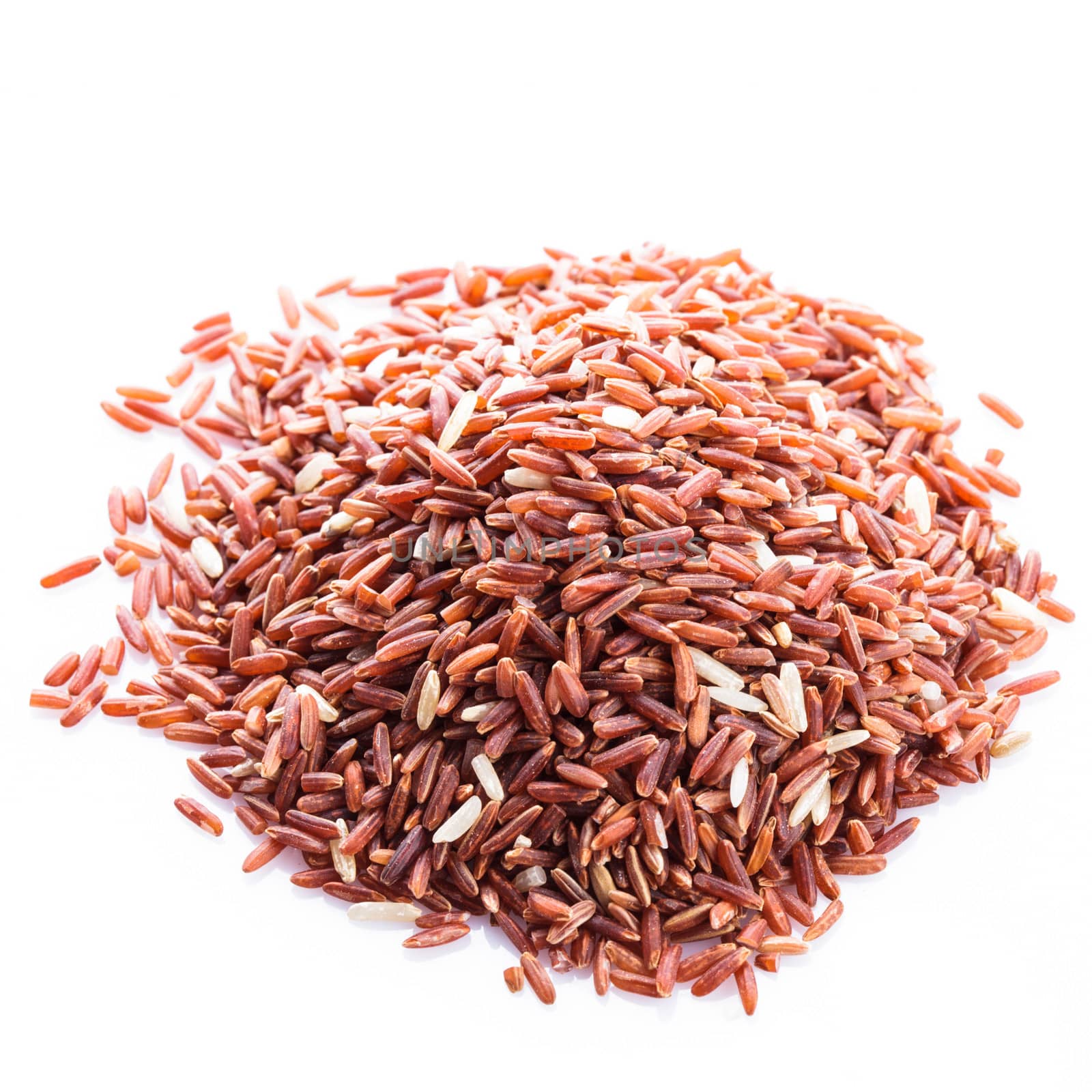 Red rice heap isolated on a white background