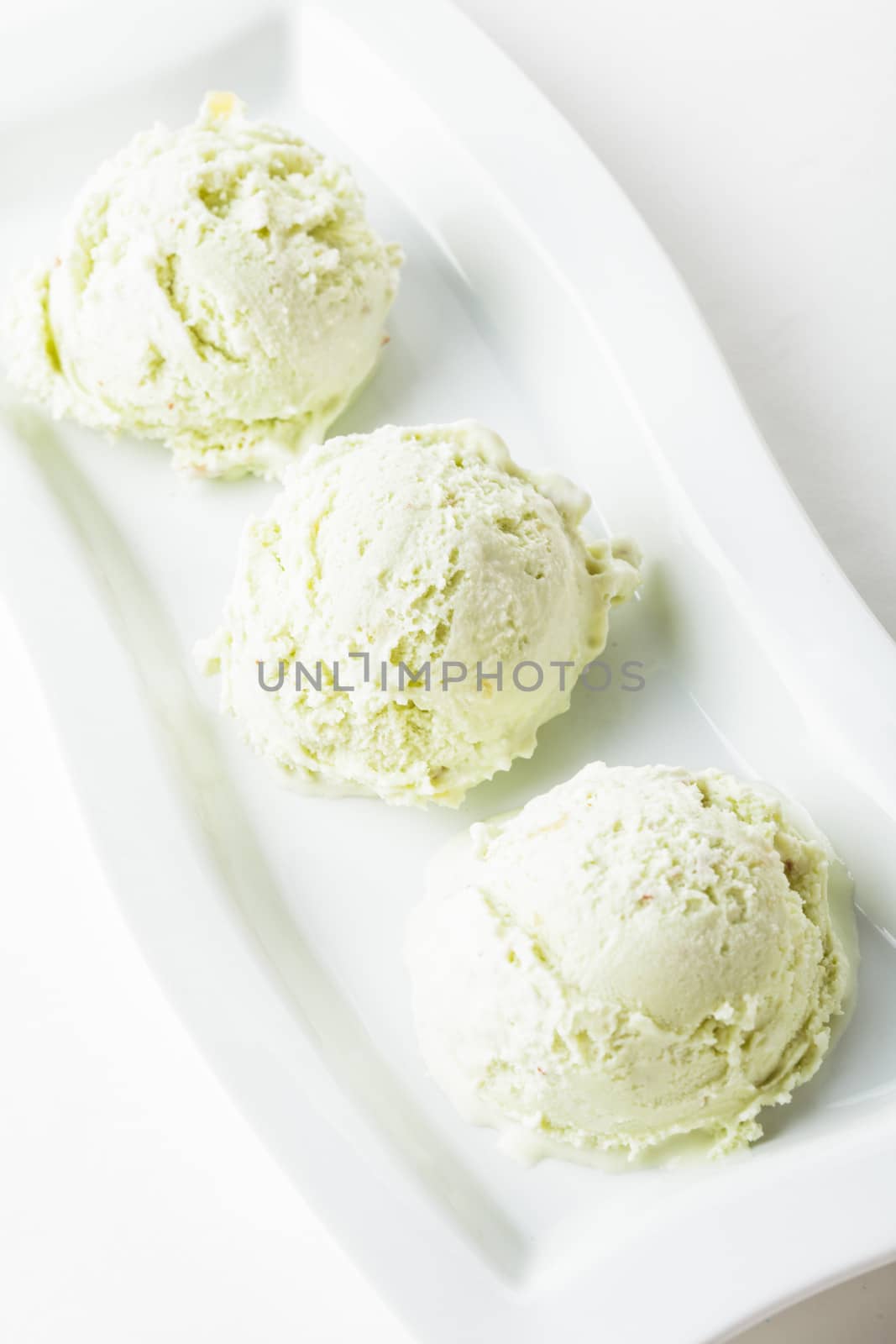 pistachio ice cream on the plate close up