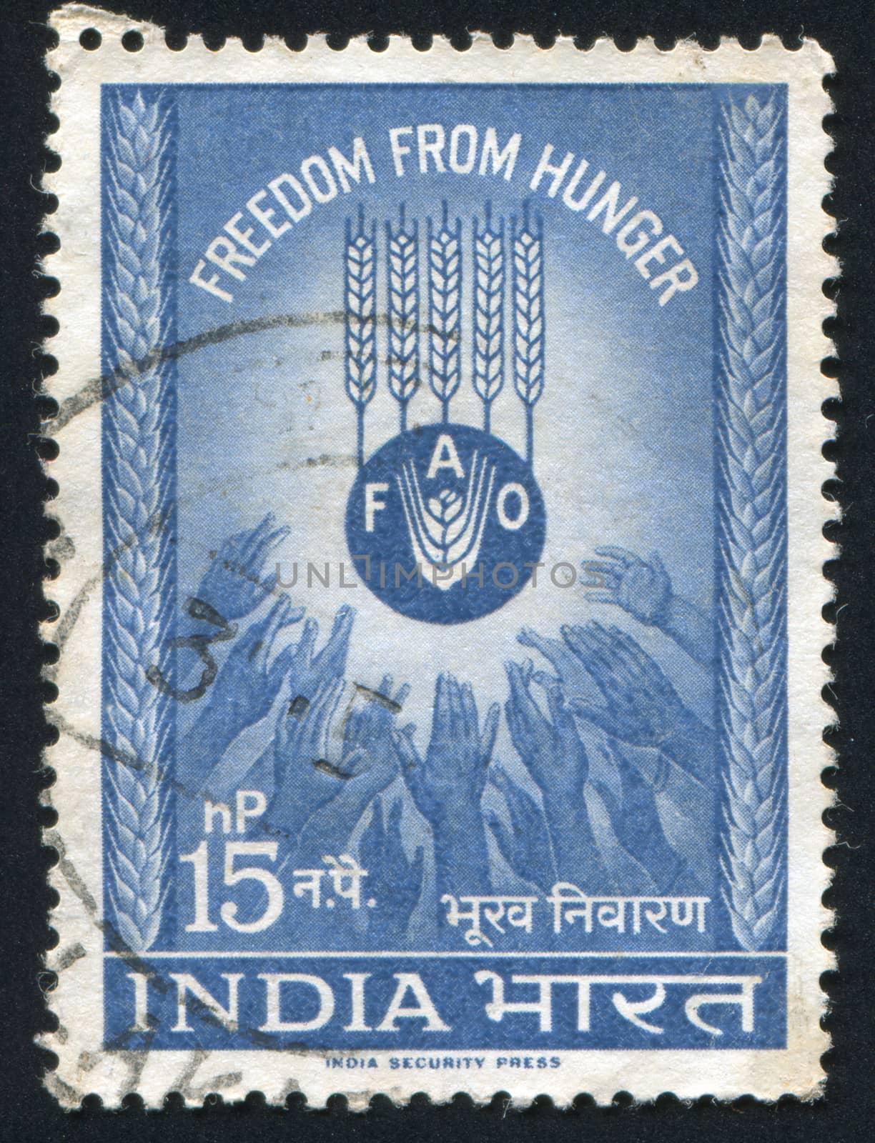 INDIA - CIRCA 1953: stamp printed by India, shows ears of rye and hands, circa 1953