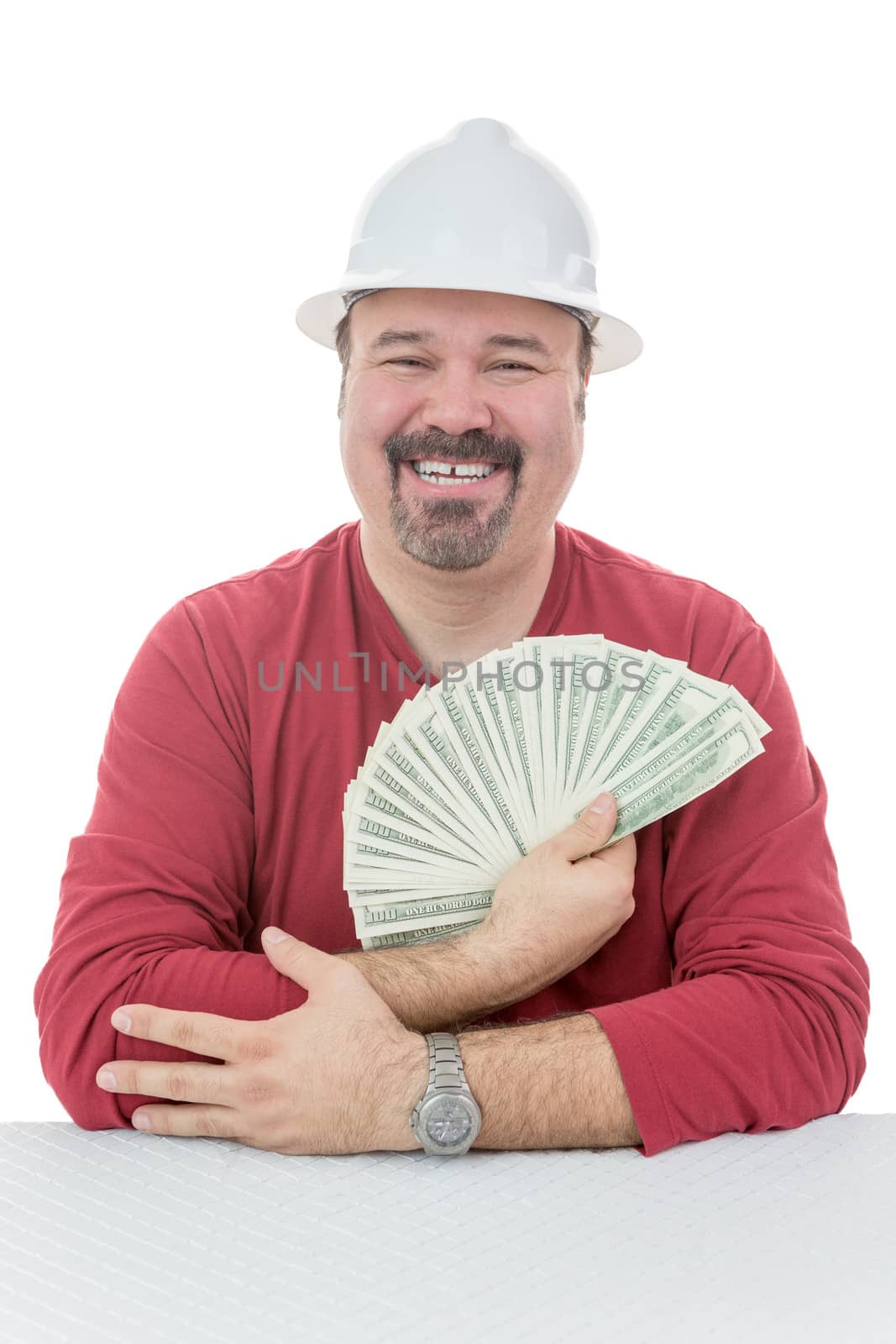 Happy construction worker holding dollar bills by coskun
