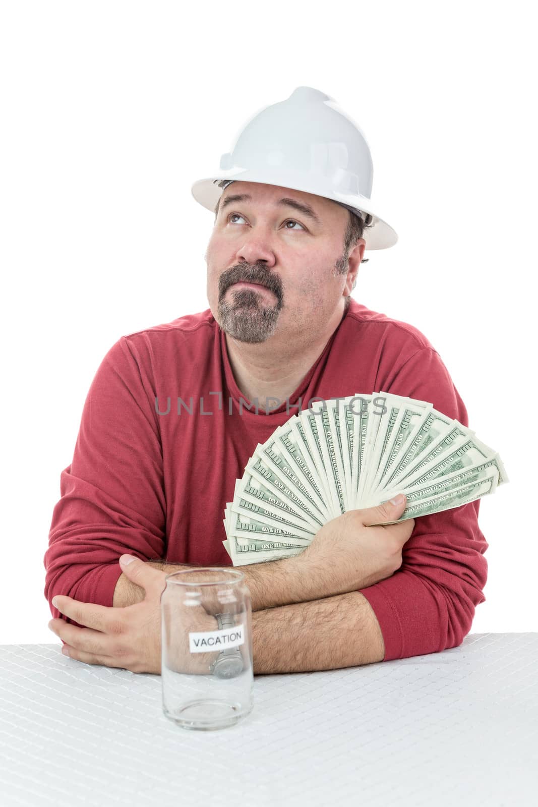 Unhappy construction worker holding to tax money by coskun