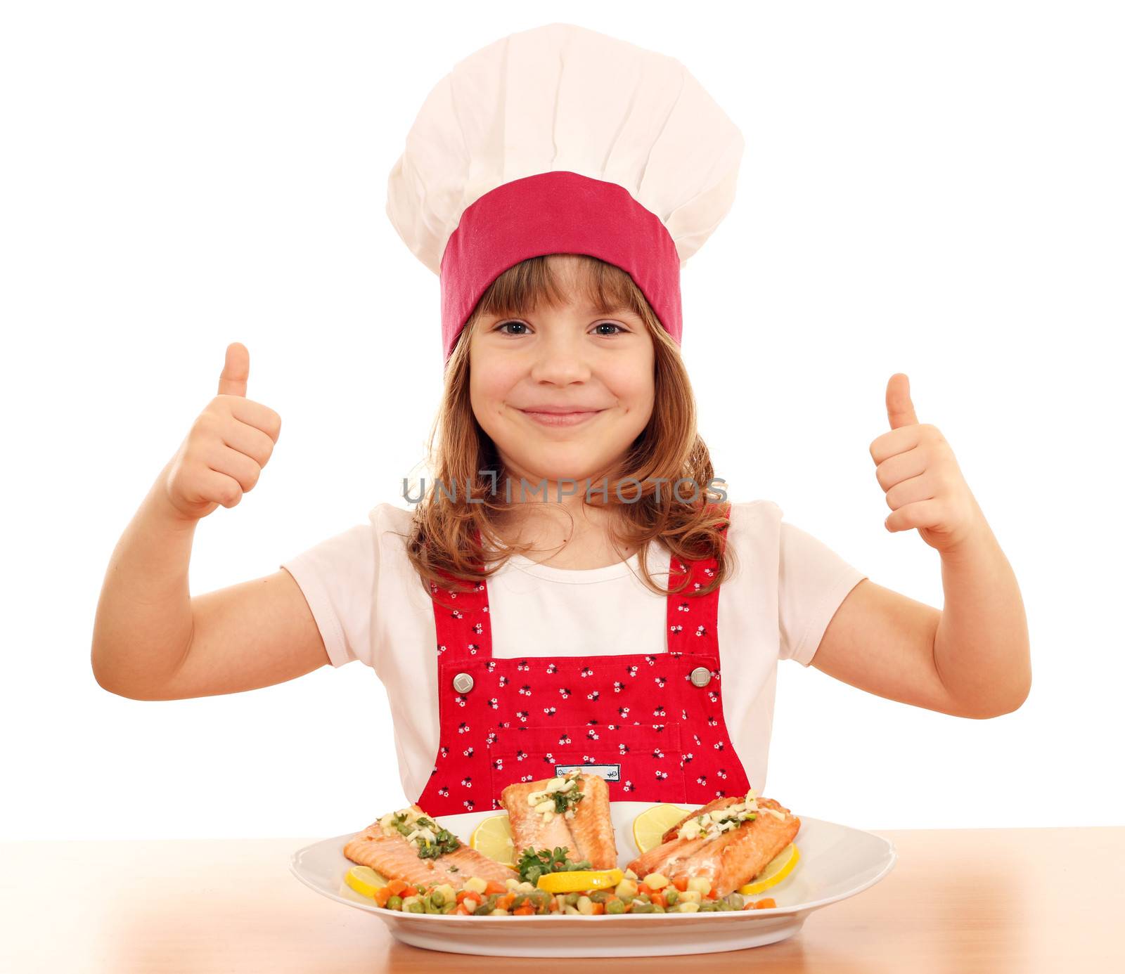 happy little girl cook with thumb up and salmon seafood