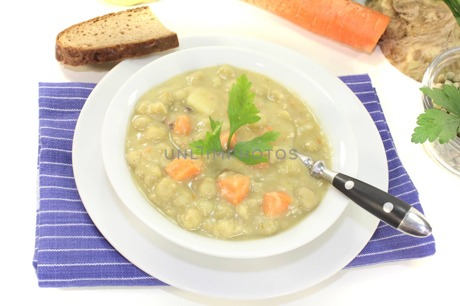 pea stew with carrots and celery on a light background