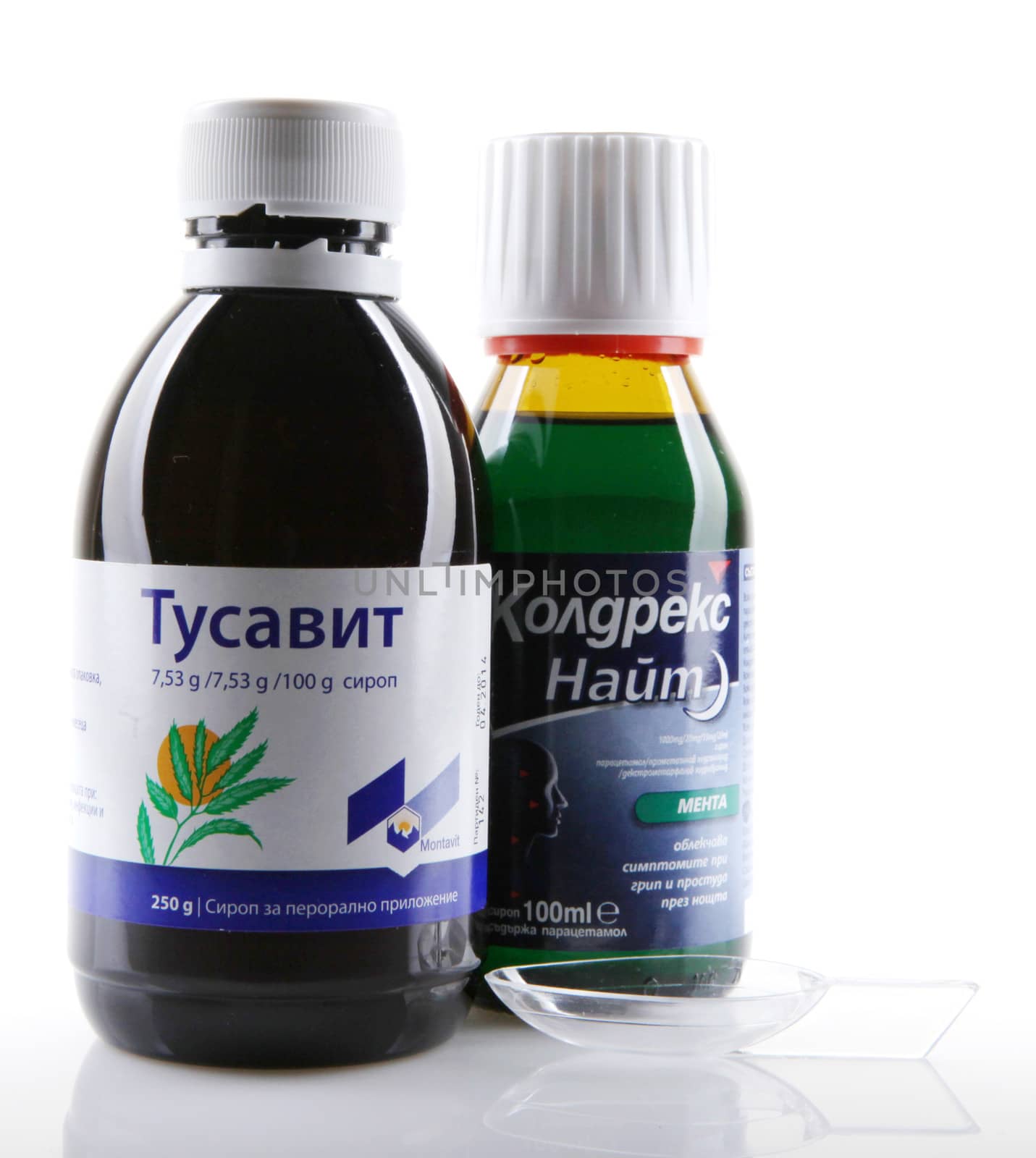 AYTOS, BULGARIA - JANUARY 28, 2014: Liquid medicine in glass bottle - Tusavit, Coldrex Nite.
