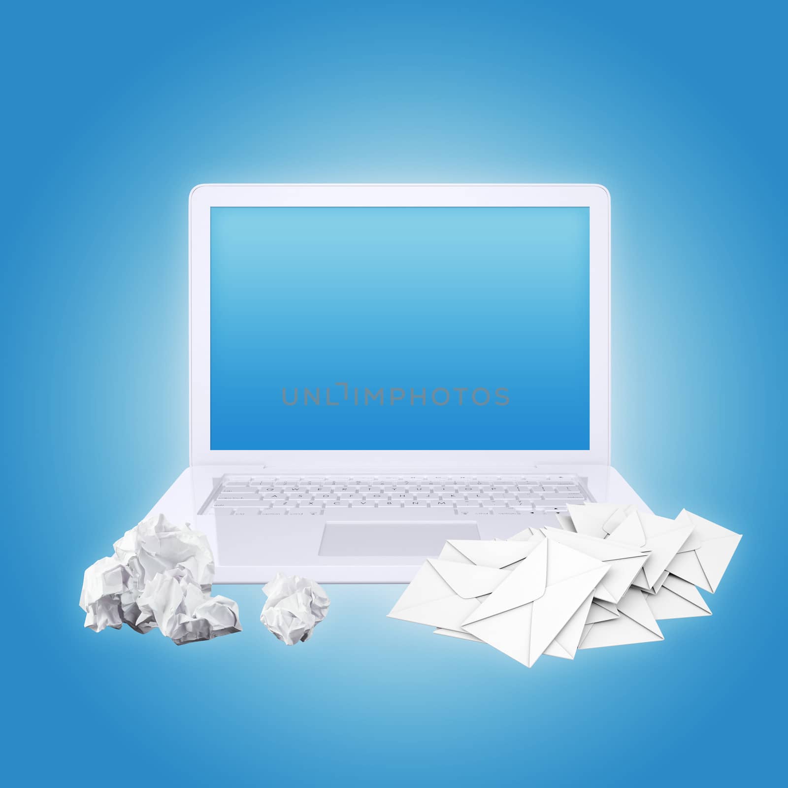Laptop crumpled paper and envelopes. The concept of e-mailing