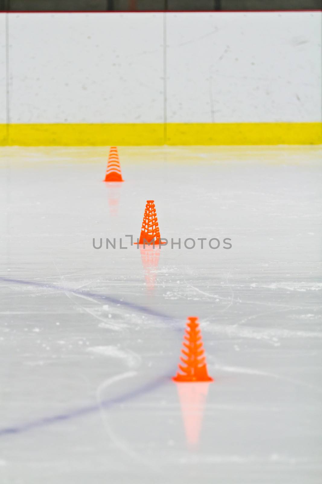 Pylons on the ice in an arena