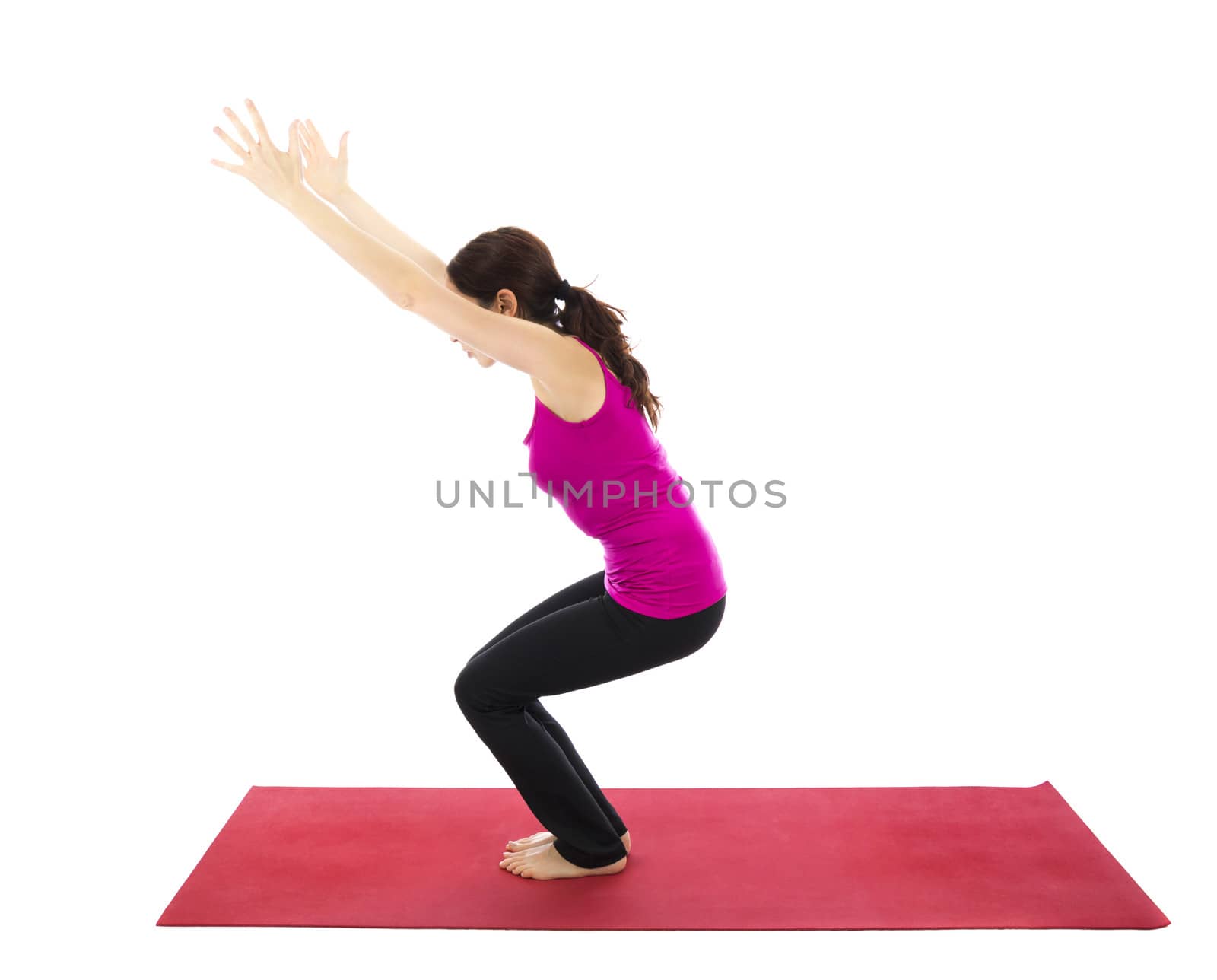 Woman doing Chair pose during Yoga (Series with the same model available)