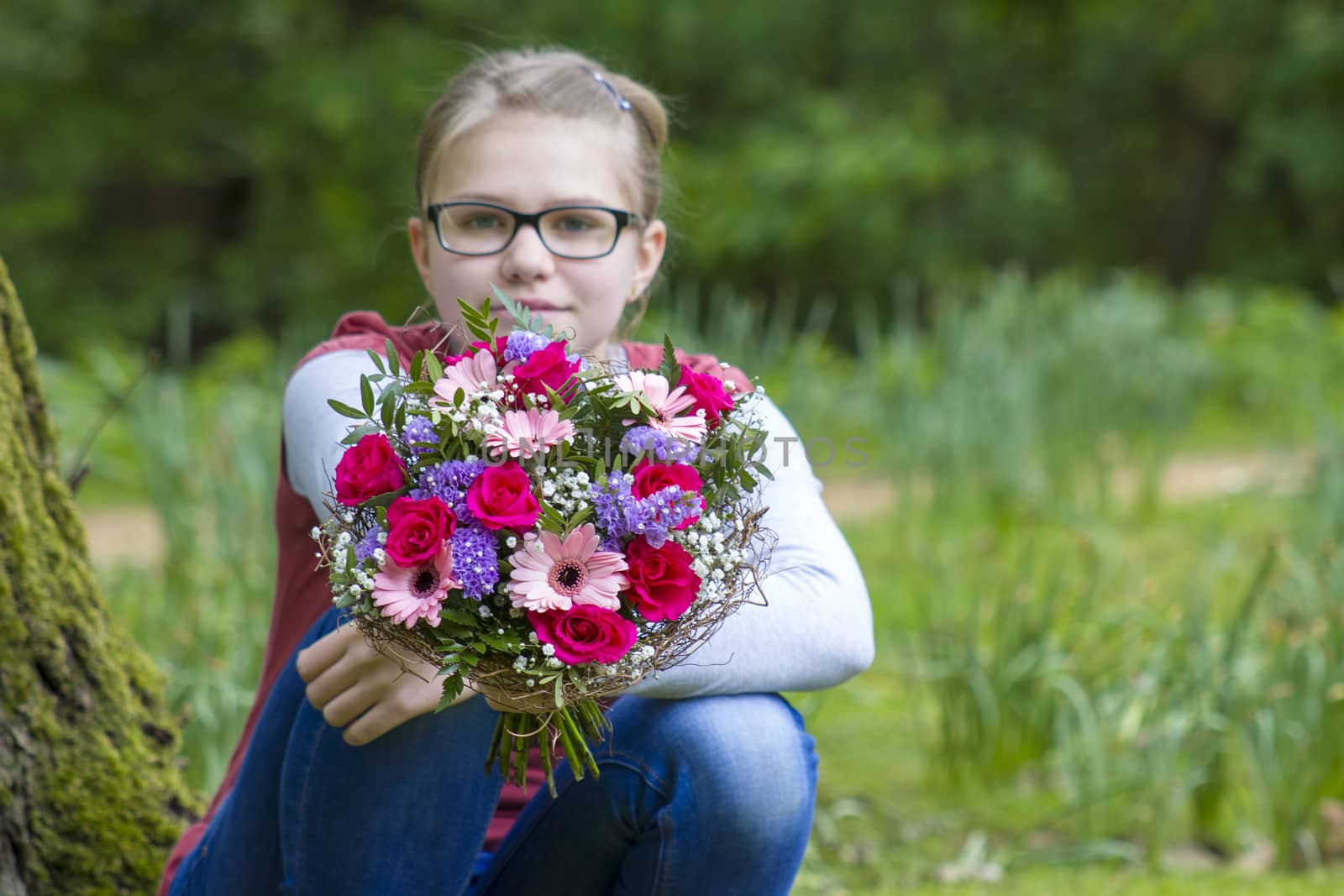 cute young girl with flowers by miradrozdowski