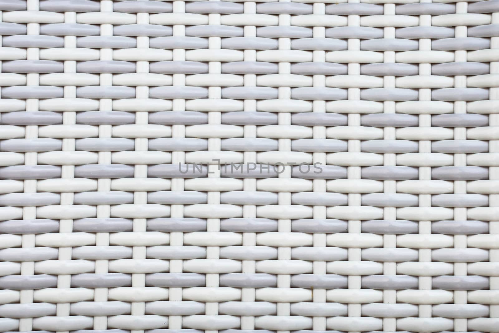 Grey and white wicker material as a background