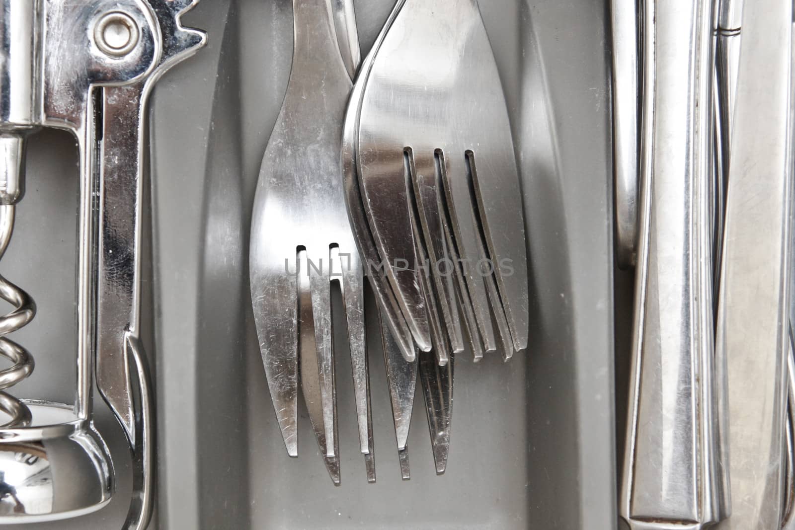 Close up of stainless steel forks in a drawer