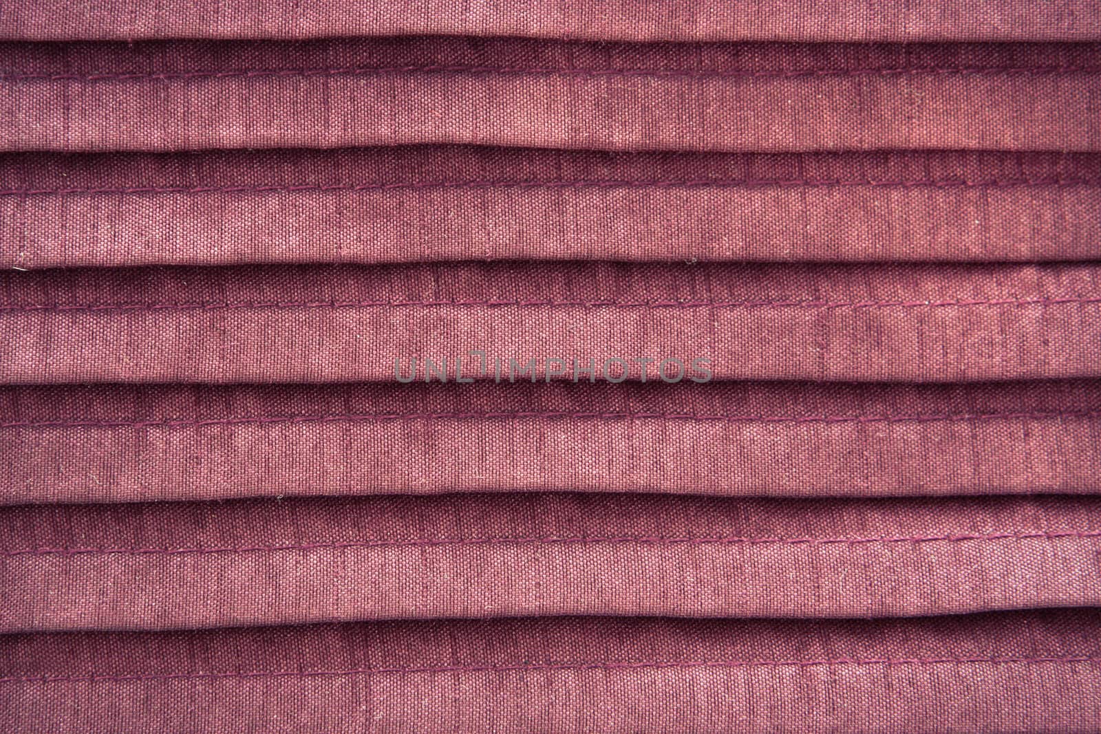 Close up of pleated pink cloth as a background