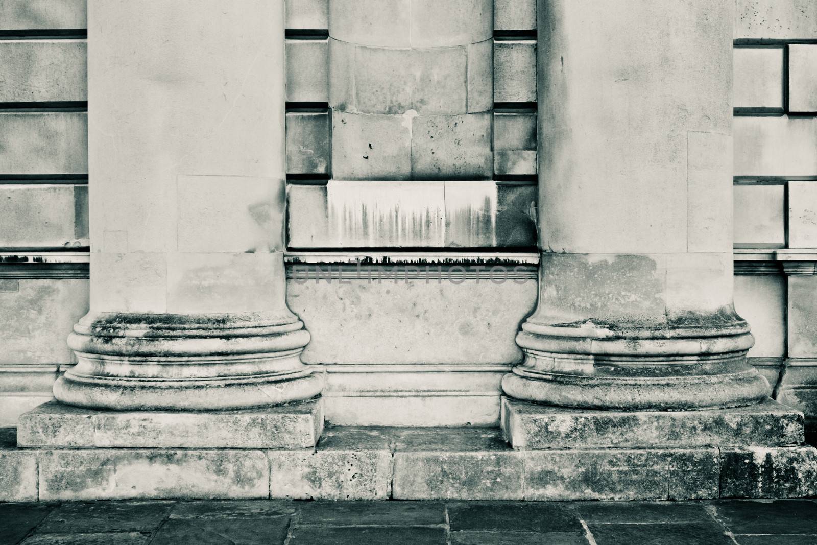 Two large stone pillars in black and white