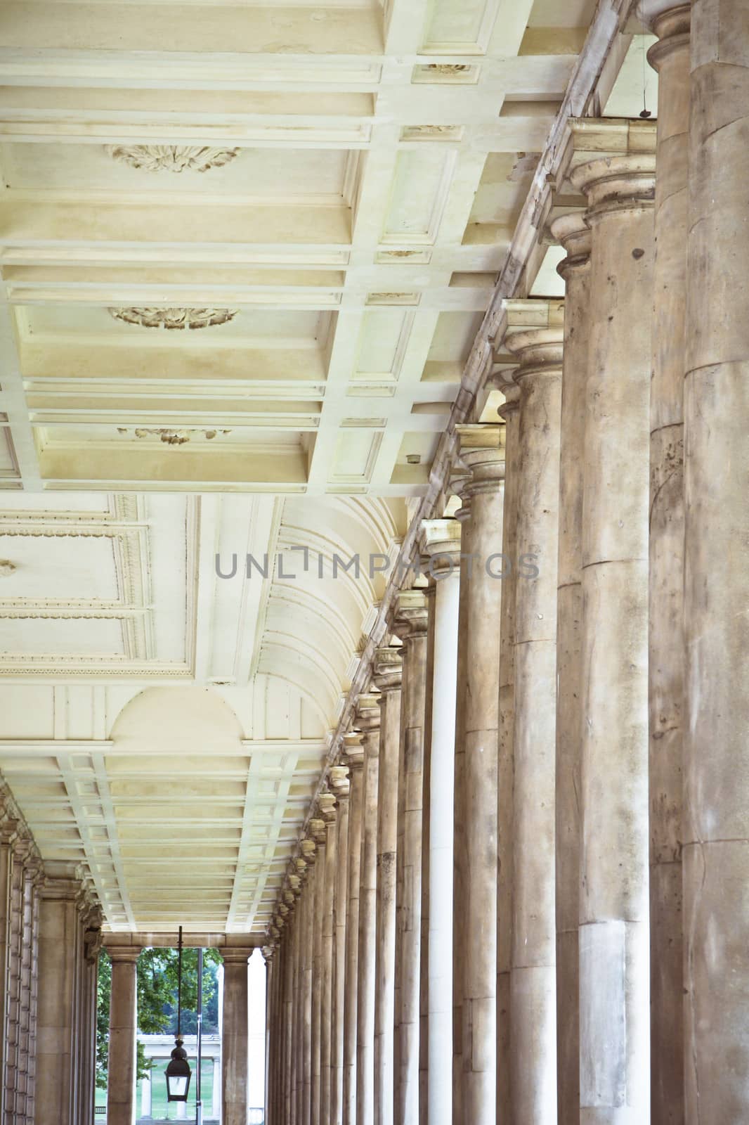 Row of pillars and decorated roof in a classic building in London