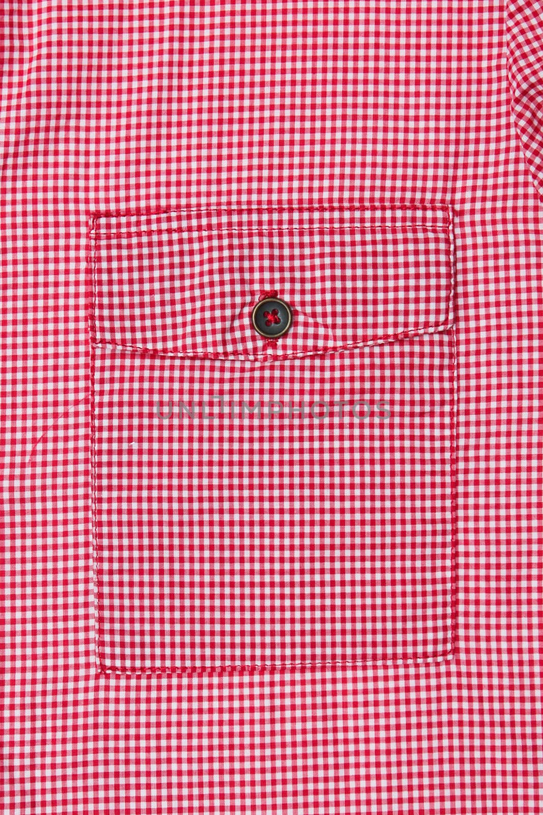 Pocket on the front of a red gingham ladies' blouse