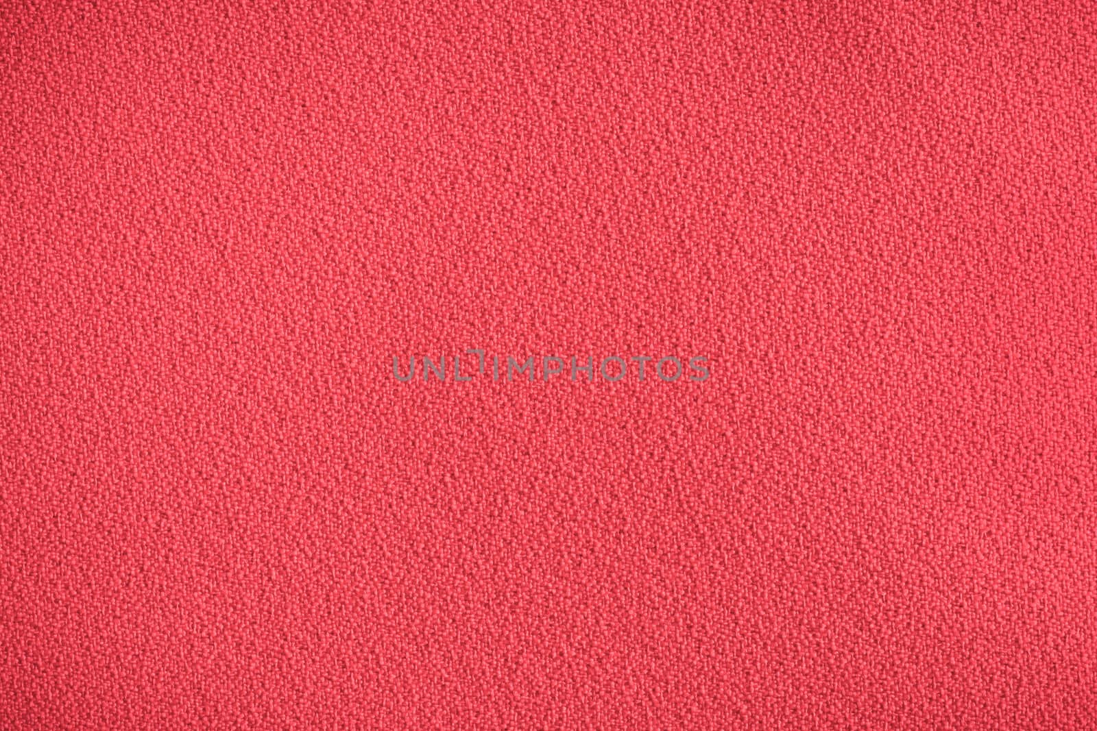 Red synthetic chair covering material as a background