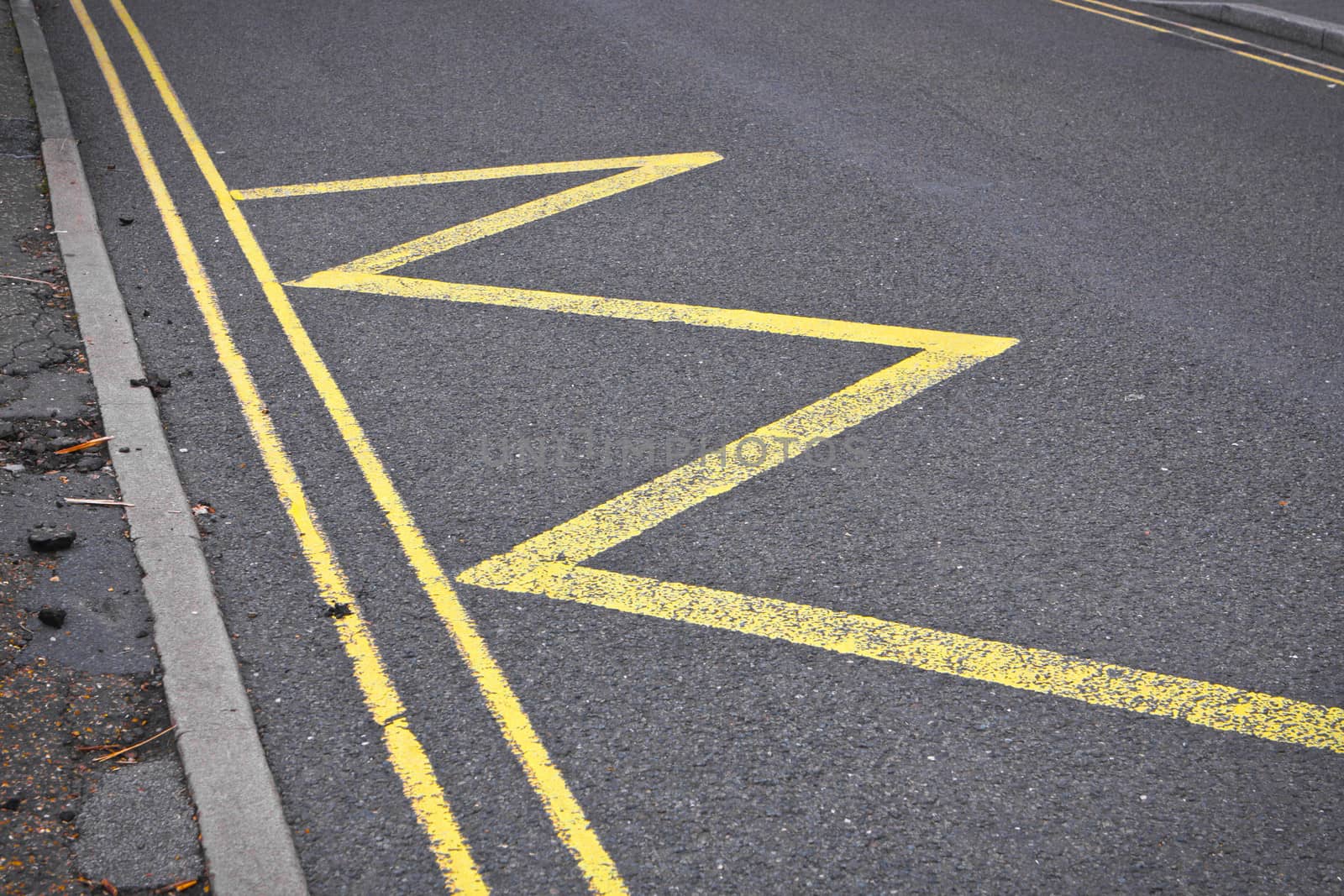 Road markings indicating no stopping or parking