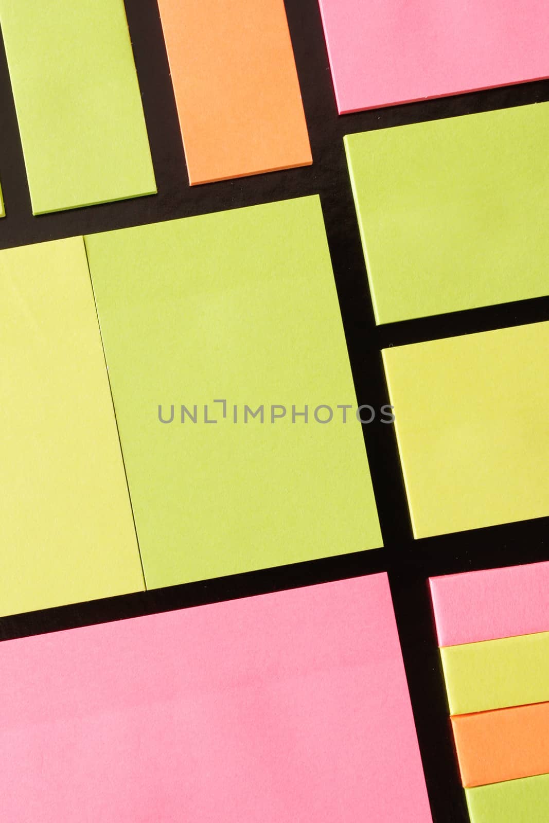 Colorful sticky note paper pads as a background