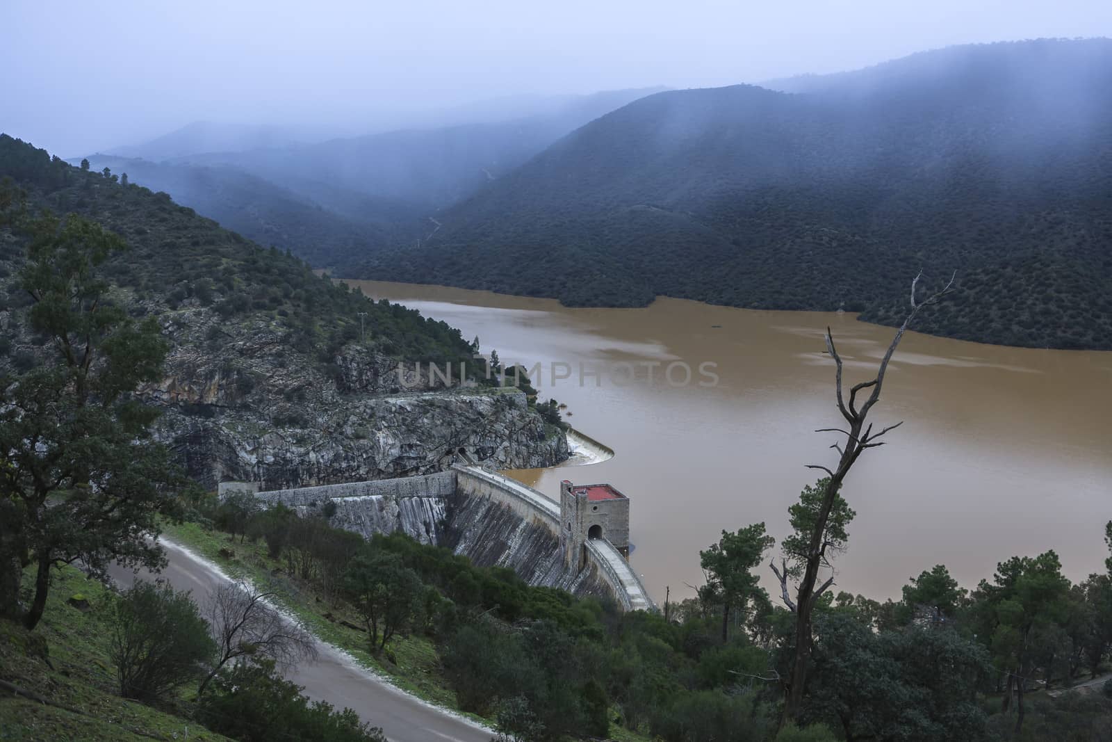 Reservoir of the Jandula in winter at full capacity after heavy rains, taken just before starting to snow, Parque Natural de Sierra Morena, Andujar, Andalusia, Spain