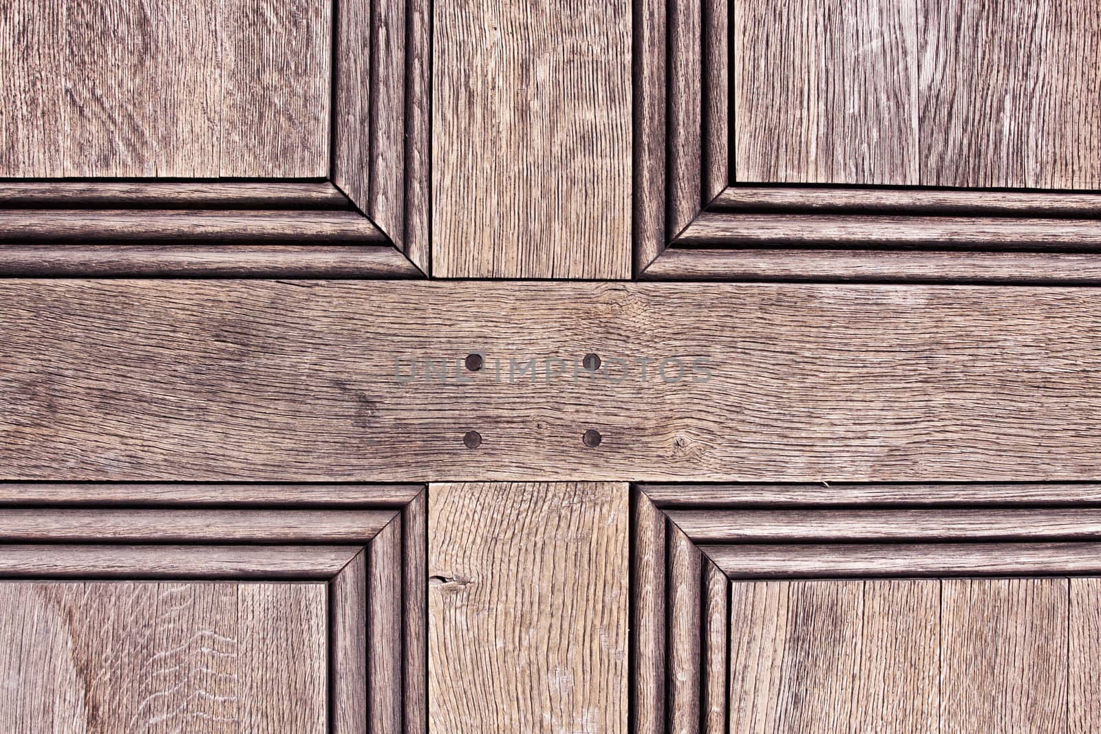 Close up of the panels of an old wooden door