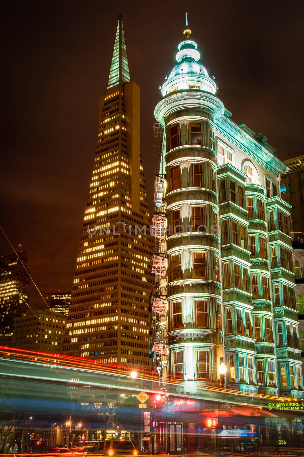 Buildings lit up at night in a city, Columbus Tower, Transamerica Pyramid, San Francisco, California, USA