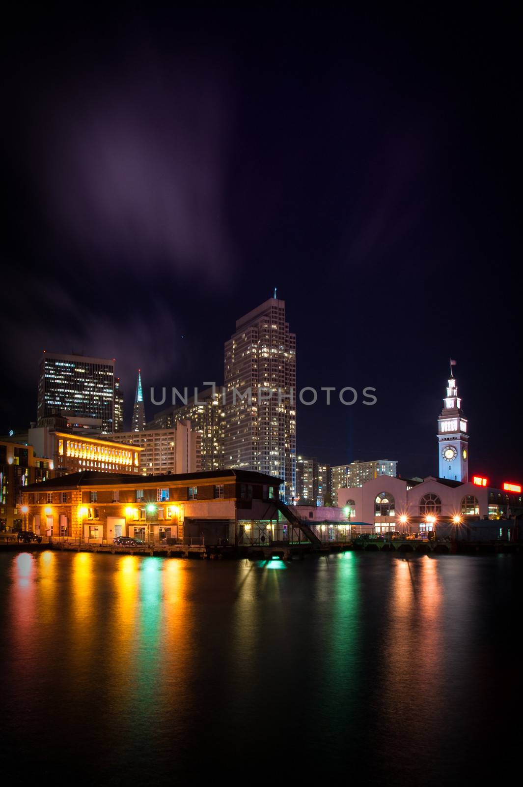 Clock tower of Ferry Building lit up at night, The Embarcadero, San Francisco, California, USA
