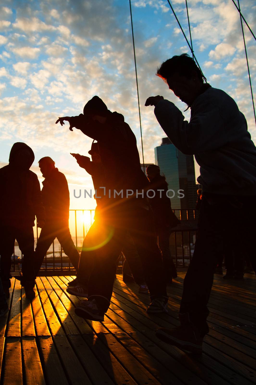 Men dancing on terrace at sunset, Midtown, Manhattan, New York City, New York State, USA
