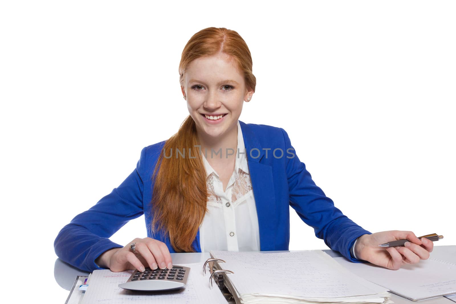 Teen business woman using the calculator and is writing bills