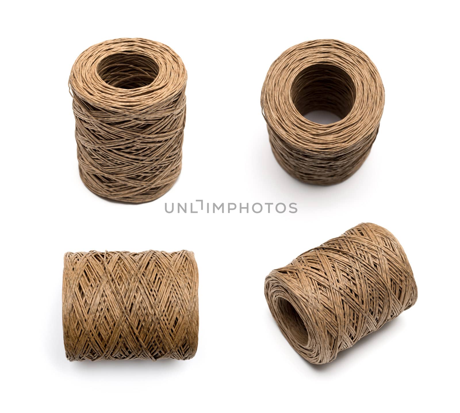 bobbin of the natural country thread isolated on white background