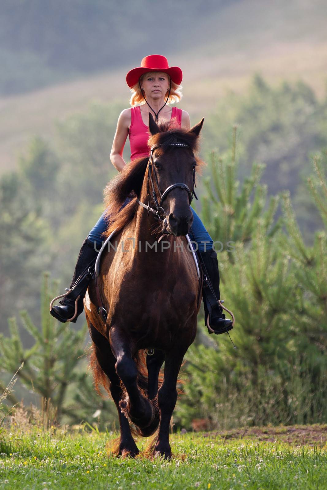 Woman in red hat riding by maros_b